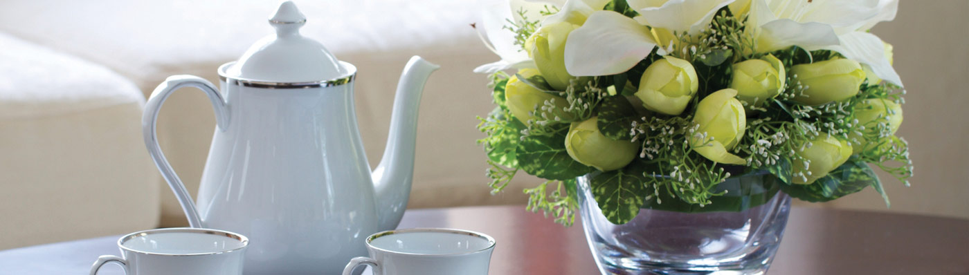 tea set next to flower setting